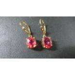 A pair of 9ct gold red topaz earrings - 3 cm long - approximately 3.