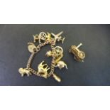 A 9ct Yellow Gold Charm Bracelet with a loose 9ct Charm - weight approximately 41 grams - minor