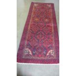 A Hand Knotted Baluchi Rug, 2.07m x 0.91m