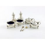 A six-piece silver condiment set, by Walker and Hall, London 1937, circular form, gadroon borders,