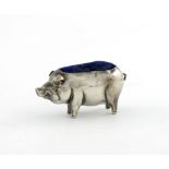 An Edwardian novelty silver pig pin cushion, by The Boots Pure Drug Company, Birmingham 1906,