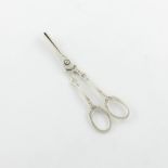 A pair of American silver grape scissors, by Tiffany and Co, engraved decoration, ring handles,