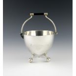 After a design by Christopher Dresser, a Victorian electroplated swing-handled sugar bowl, by