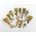 λ A collection of ten 19th century gilt-metal posy holders, various designs, some with ivory and