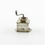 A 19th century Dutch miniature silver coffee grinder, with Amsterdam marks and a pseudo Van Geffen