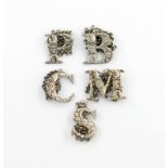 A collection of five 19th century silver 'cut-out letter' wine labels, by Yapp and Woodward and