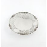 A silver dish, by Gladwin Limited, Sheffield 1947, circular form, pierced grapevine decoration,