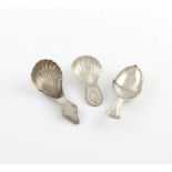 A small mixed lot of three silver caddy spoons, comprising: one by Richard Morton, Sheffield 1790, a