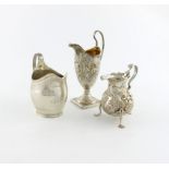 A small collection of three Georgian silver cream jugs, comprising: one by Peter and William