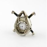A Victorian novelty silver clock, by James Green, London 1882, modelled as a ploughing yoke, with