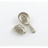 A George III silver caddy spoon, by Samuel Pemberton, Birmingham 1807, oval bowl, set with an oval