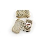 A collection of three American silver vesta cases, comprising: one with a scene of a bulldog and '