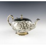 λ A Victorian silver tea pot, by Martin, Hall and Company, London 1887, circular form, embossed
