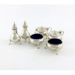 A matched six-piece silver condiment set, London various dates and makers, circular form, gadroon