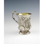 A Victorian silver mug, by Henry Holland, London 1851, circular baluster form, with figural panels