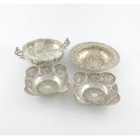 A mixed lot of silver dishes, comprising: a pair of square form, embossed decoration, London 1896, a