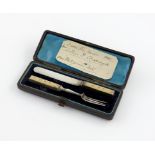 A late-Victorian novelty parcel-gilt silver retractable pencil and toothpick, unmarked, retailed
