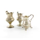A small collection of three Georgian silver cream jugs, comprising: one by Hester Bateman, London