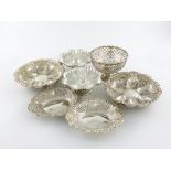 A mixed lot of silver dishes, comprising: one of pierced circular form, Sheffield 1930, a pair of