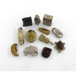 λ A collection of twelve base metal vesta cases, various designs including: a turtle, an elephant,