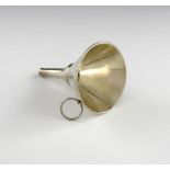 An 18th century silver spirit funnel, unmarked, conical form, with a ring attachment, height 9cm,