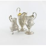 A small collection of three Georgian silver cream jugs, comprising: one by Stephen Adams, London