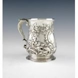 A George II silver mug, maker's mark worn, I?, London 1737, baluster form, later embossed foliate