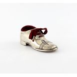 A novelty silver shoe pin cushion, by S. Blanckensee and Sons, Chester 1910, modelled as a