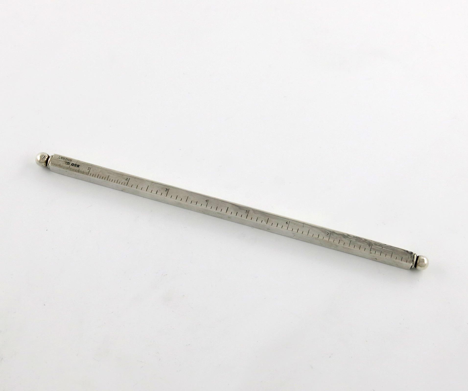 An Edwardian silver ruler / pen / pencil, by Cohen and Charles, Chester 1901, rectangular form,