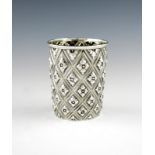 A Victorian silver beaker, by Henry Holland, London 1865, tapering circular form, triangular lattice