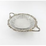 A silver two-handled dish, by Walker and Hall, Sheffield 1927, circular form, pierced and engraved