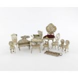 A collection of silver miniatures, comprising: a chair with a velvet seat, Birmingham 1901, possibly