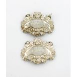 A pair of George III silver wine labels, by D. Hockley, London 1817, shaped oval form, with a