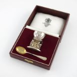 By Asprey, a novelty silver egg cup and spoon, London 1985/86, modelled as humpty dumpty, in a