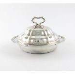 An Edwardian silver muffin dish and cover, by H. Atkins, Sheffield 1909, shaped circular form,