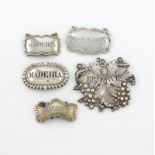 A collection of five antique silver wine labels, comprising: a Swedish label, maker's mark GM, 1848,