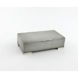 A silver cigarette box, by A. Wilcox, Birmingham 1934, rectangular form, engine-turned decoration,