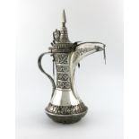 A Middle Eastern metalware coffee jug, tapering circular form, hinged cover with a pointed finial,