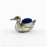 An Edwardian novelty silver duck pin cushion, by Crisford and Norris, Birmingham 1906, modelled in a