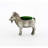 An Edwardian novelty silver goat pin cushion, by Adie and Lovekin, Birmingham 1909, modelled in a