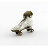 A novelty silver roller skate pin cushion, by Spurrier and Co, Birmingham 1910, length 6.8cm.