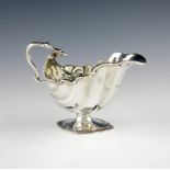 A late-Victorian silver sauce boat, by Charles Stuart Harris, London 1896, shaped oval form, snake