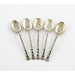 By Liberty and Co, a set of five silver and enamel teaspoons, Birmingham 1936, the tapering stems
