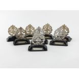 A set of eight late-Victorian silver Regimental menu card holders, apparently unmarked, circa