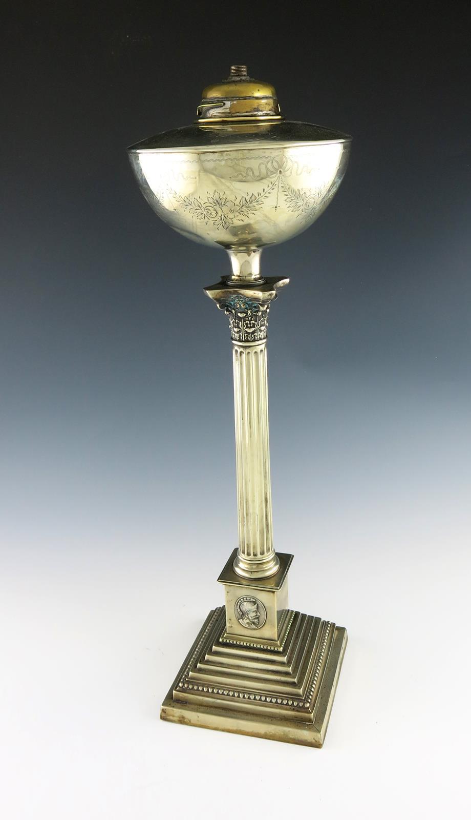 A late-Victorian electroplated oil lamp, Corinthian column form, with a circular oil holder,