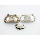 A small collection of three antique silver wine labels, comprising: an unmarked one of scroll