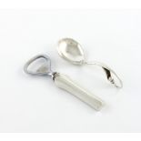 By Georg Jensen and Wendel, a Danish silver spoon, design number 21, with a bud finial, plus an