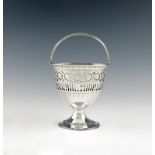 A George III silver swing-handled sugar basket, possibly by Samuel White, London 1780, circular