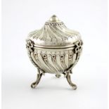 A Victorian silver string box, by William Comyns, London 1889, circular form, fluted decoration,