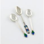 By Liberty and Co, an Art Nouveau silver and enamel spoon, also marked Cymric, the terminal with